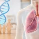 Wooden family figures holding hands beside a blue DNA double helix, with a translucent chest showing lungs and a tumor in the right lung.